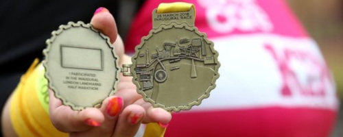 Runner showing their LLHM medal