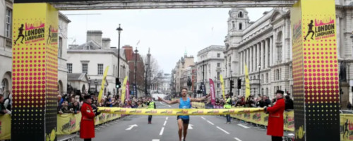 First runner crosses the London Landmarks Half Marathon 2018 finish line.