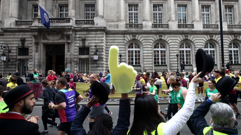 Volunteers cheering runners
