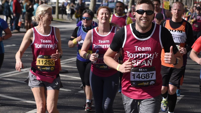 A group of runners in Tommy's running vests