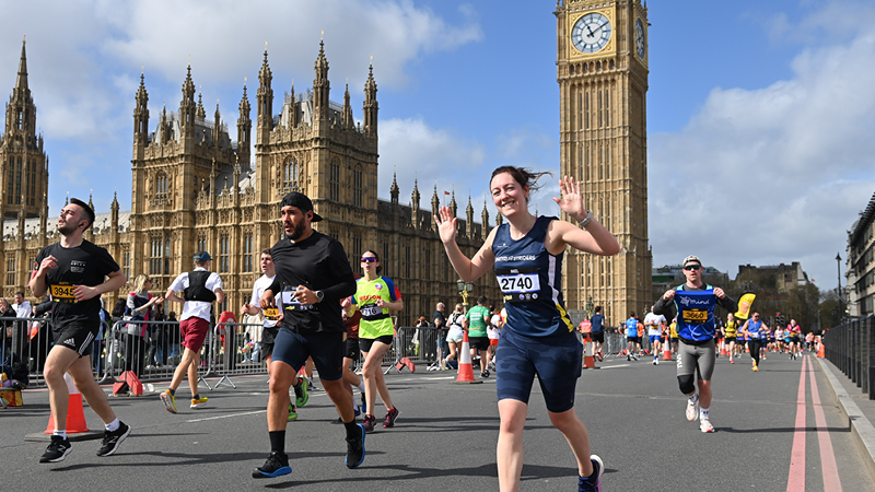 Woman running under big ben