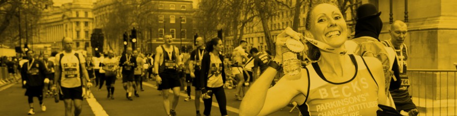 Charity runner holding their medal