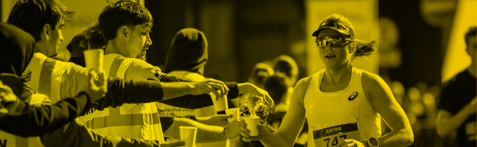 Volunteer handing out drink